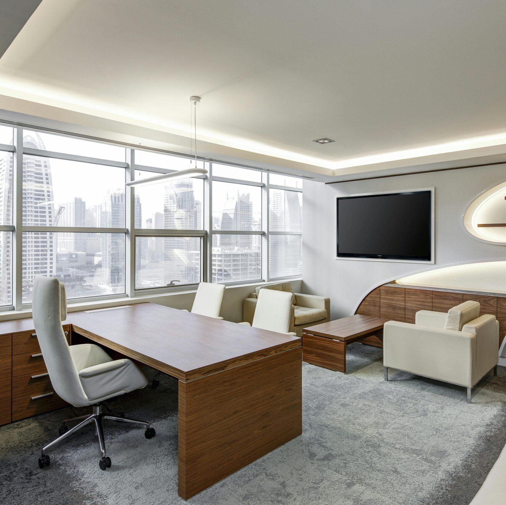 Sleek office space featuring contemporary furniture and city skyline views, ideal for professionals.